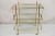 Mid Century Italian Modern 3 Tier Brass & Glass X-Frame Rolling Server Bar Cart. Circa Mid 20th Century. Measurements: 41"...
