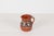 Add earthy warmth and rustic folk-art charm to your interior with this small vintage Mexican terracotta pitcher, featuring...