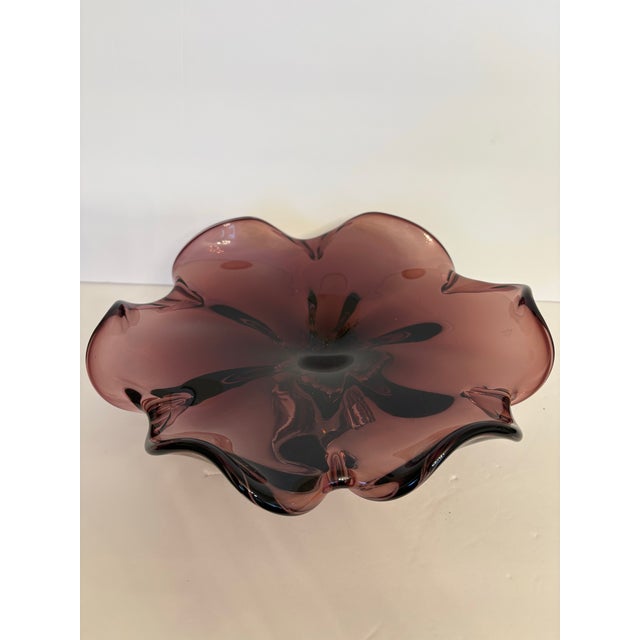 This vintage royal gallery amethyst art glass bowl that is 12" across is hand blown from Poland and is vey heavy. The...