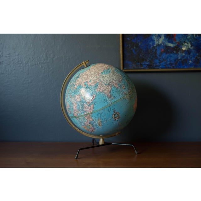 Vintage desk or tabletop globe map with metal atomic stand by George F. Cram Company. This piece rotates on a semi-...