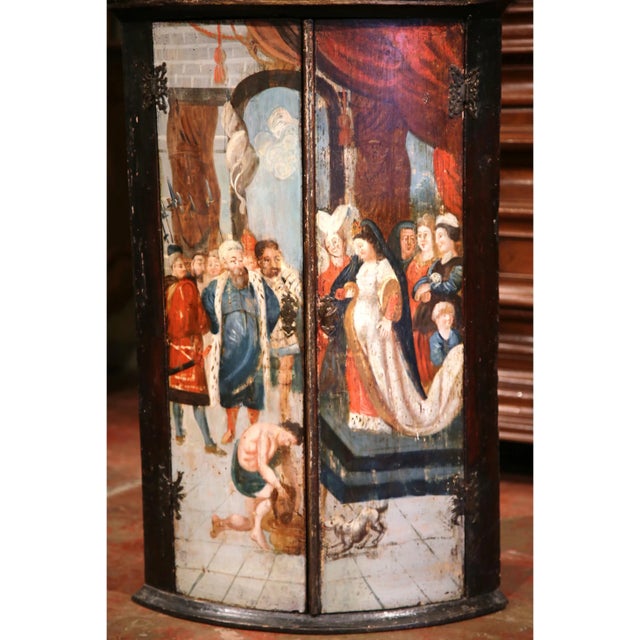 Richly painted and highly unusual, this antique Italian corner cabinet was crafted circa 1780. The bow-front encoignure...
