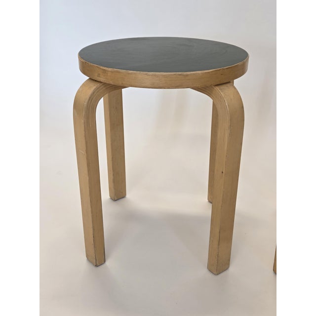 Artek E60 stools, 2 pcs. Birch with dark green linoleum. The stools are from the 1960s/70s and in good used condition....