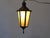 This lantern with verdigris finish has slag glass panels. It ships with the panels removed and packed separately.