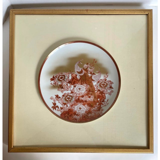 Here is an elegant pair of matching, but not identical, Japanese Kutani plates. The piece are hand-painted in shades of...