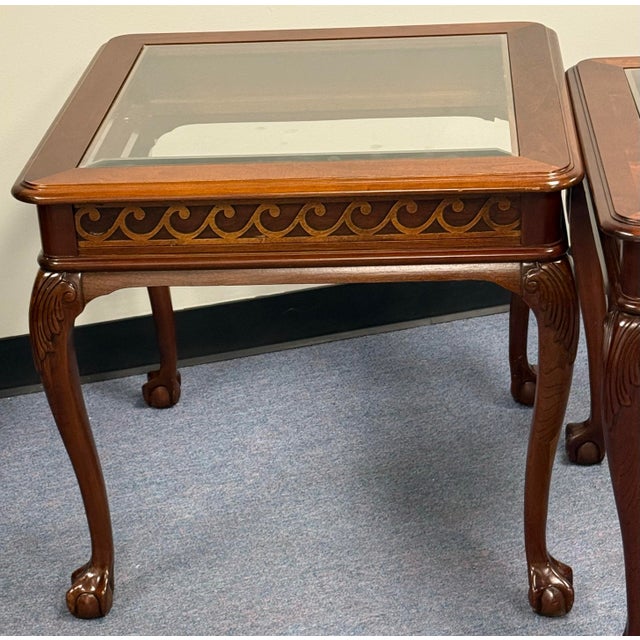 Elegant Pennsylvania House cherry end tables featuring a beveled glass inset top, richly carved apron, graceful cabriole...