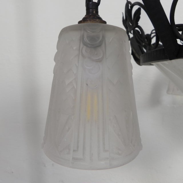 This beautiful art deco pendant lamp by muller freres has a glass bowl in the middle, located in a steel frame. a new...
