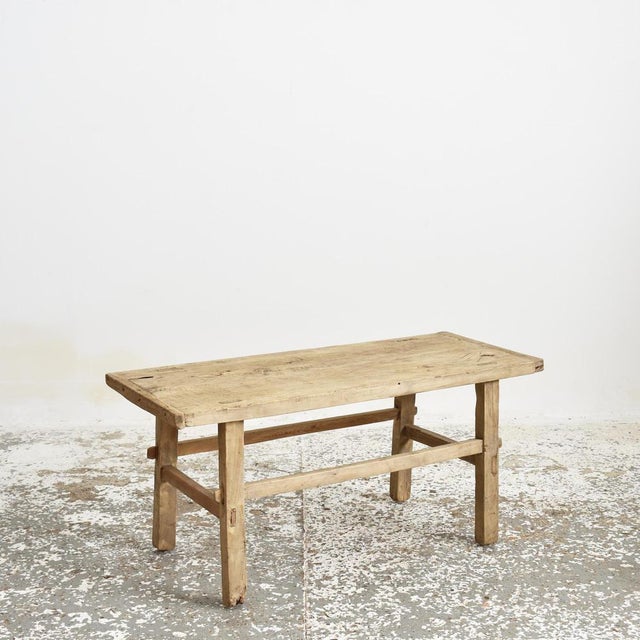 A beautiful vintage solid wooden elm coffee table. Lovely original patina. The table top has a lovely slight curved dip in...
