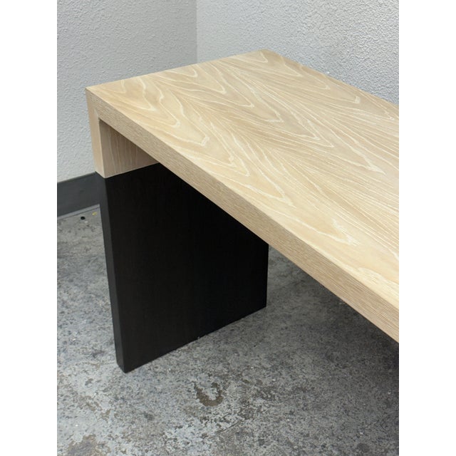 Design Plus Gallery presents a Modern Bespoke Waterfall Console Table. This contemporary console pairs a pale wood grain...