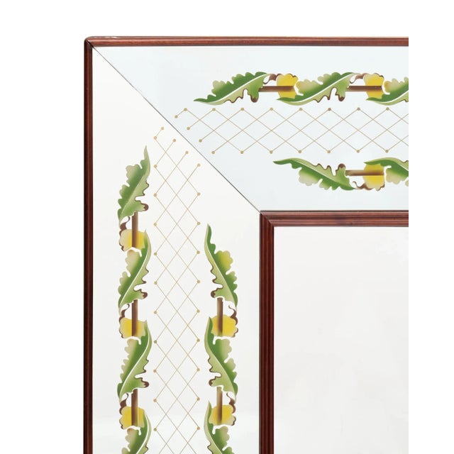 Italian eglomised mirror by Lugigi Brussotti. This mirror has freezes of stylized oak leaves. This mirror includes a...