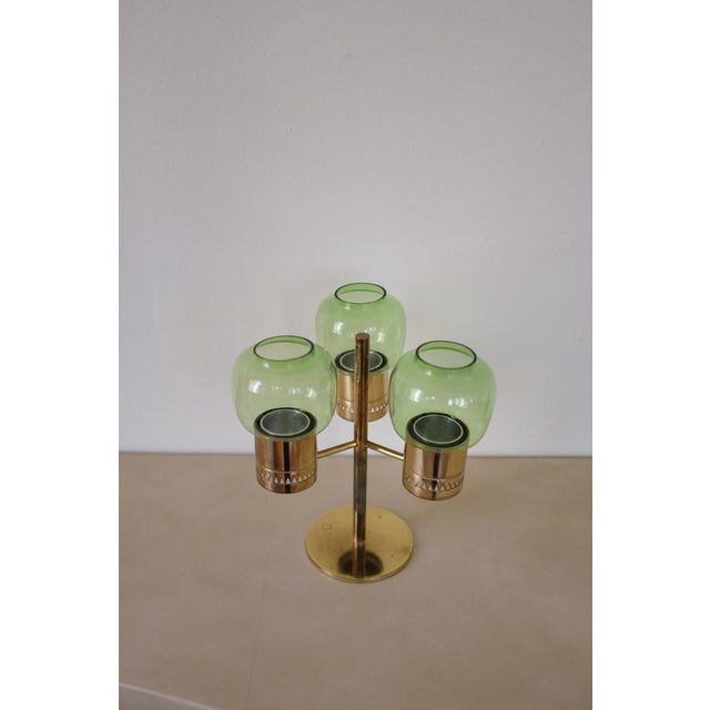 Beautiful Brass candleholder with 3 green lanterns by Hans-Agne Jakobsson. Produced by the designer own company in...