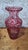 Large red overlay crystal vase, with a slender baluster shape and a strongly constricted neck surmounted by a flat, flared...