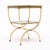 Side table from the Art Deco period in France made of brass with an antiqued mirrored top and antiqued mirrored shelf. The...