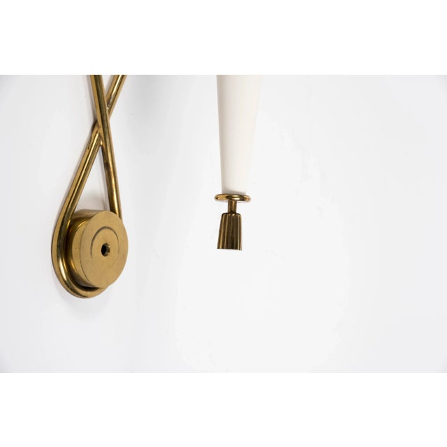 Sconces in the style of Gilbert Poillerat, 1950s, Set of 2, in Very Good conditions. Designed 1950 to 1959 This piece is...