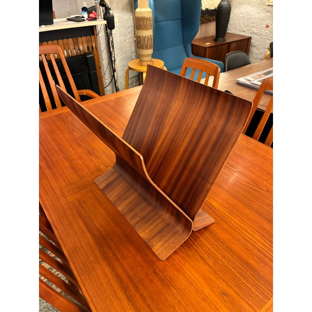 Modern bent Mahogany plywood magazine rack by Paul Rowan for Umbra, circa 1980. Unmarked, well documented, authentic.....