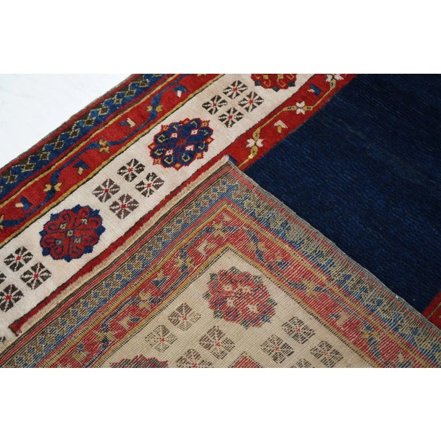 Classic SE Caucasian Talish with the desirable dark blue, totally open field and the ivory rosette and "dice" border....