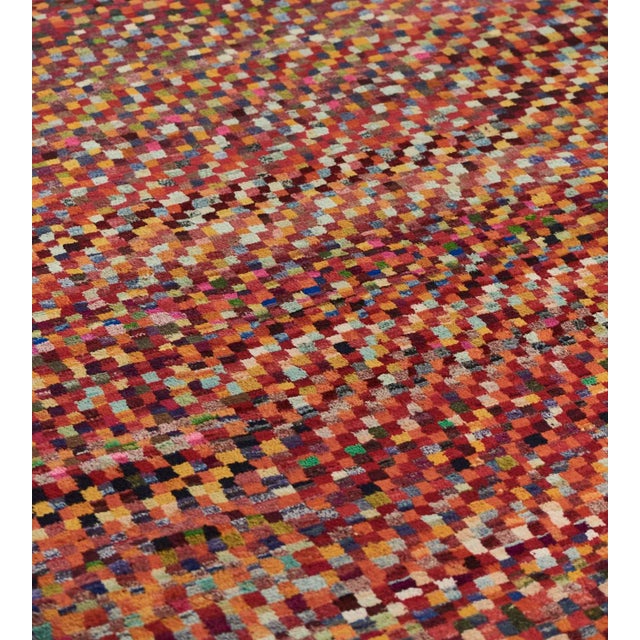 Part of the Mansour Modern collection, this deep-pile, hand-woven Deco rug has an overall field of polychrome cells in a...