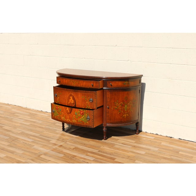An elegant early 20th-century Louis XV style sideboard by the renowned Blackhawk Furniture Company of Rockford, Illinois....