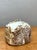 This evocative studio pottery vase is a compelling study in texture and form, characteristic of mid-century ceramic...