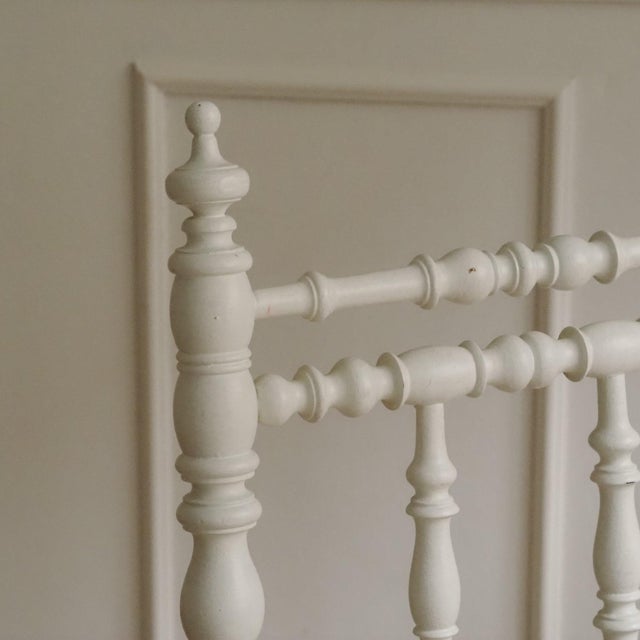 Historic wooden chair circa 1900 with a turned backrest and a particularly low seat. Later, it was finished in a lighter...