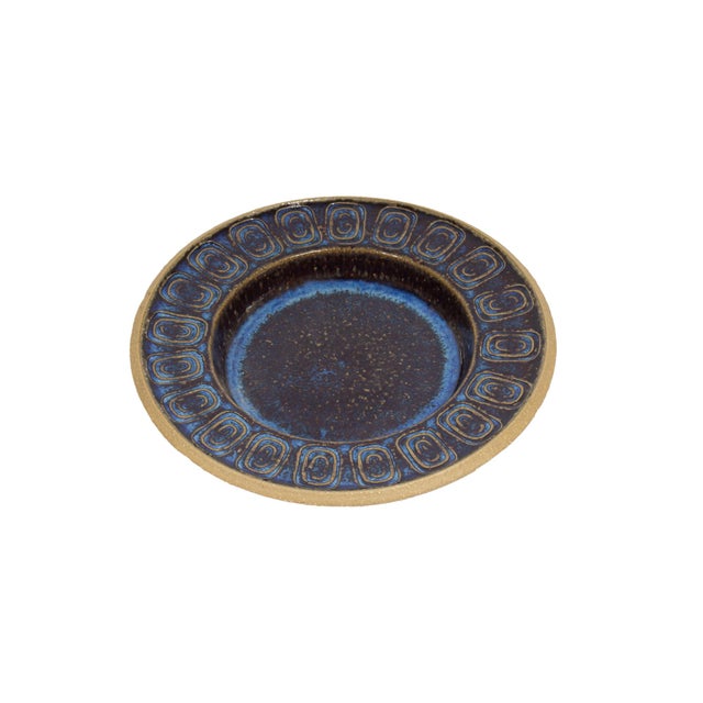 A Danish mid-century stoneware dish designed by German ceramicist Maria Philippi (1927-2004) and produced by Søholm. The...