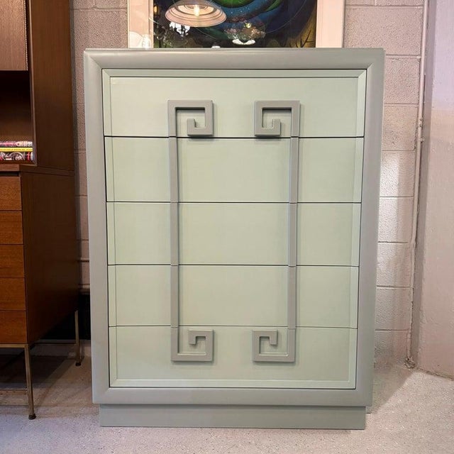 This stunning 1940s Hollywood Regency highboy dresser by Kittinger Furniture company comes from their earliest "Mandarin"...