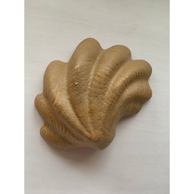 Sculptural vintage ceramic clam shell bowl with softly scalloped, ruffled edges and a creamy crackle-glazed interior. The...