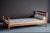 French daybed from the 1940s, made of solid oak with a simple, architectural design. Newly upholstered with a tufted seat...