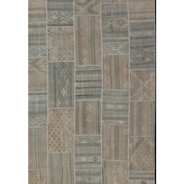 Measures: 9'3 x 11'8 Large Turkish kilim from vintage pieces skillfully put together. this fine patchwork rug has light...