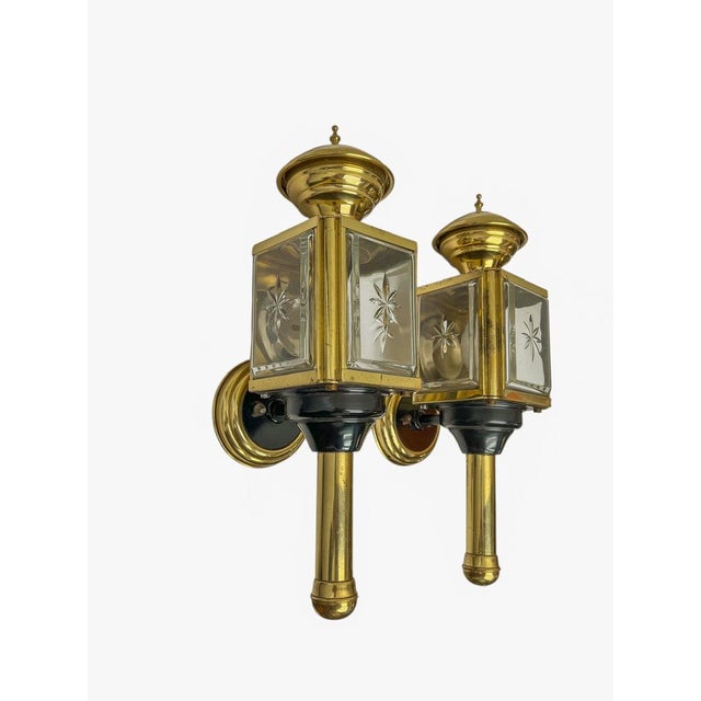 Old carriage lantern wall lamps with cut glass on 4 sides, 1950s. Made of shiny brass with black metal details. and...