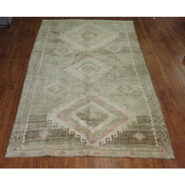mid-20th century Turkish Geometric rug featuring pops of pink with a neutral color base 6'8'' x 11'2''