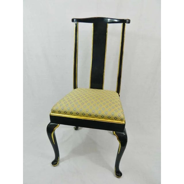 Early 20th century set of twelve Italian dining chairs with cabriole legs. Navy lacquered and gold gilt trim. We may...