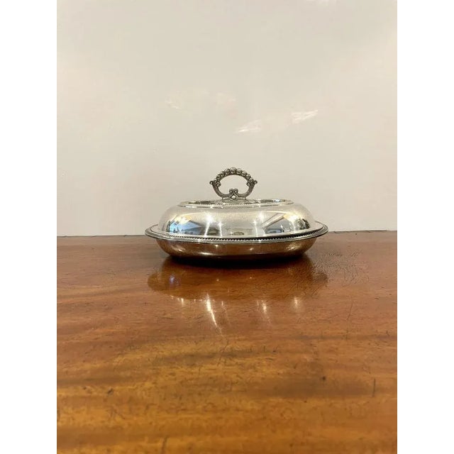 Antique Edwardian silver plated entrée dish, having a silver plated entrée dish with a lift off lid with original handle...