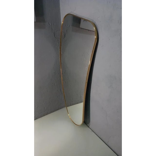 Mirror with Brass Frame in the Shape of a Banana, in Flawless conditions. Designed from 2000 I have official proof of...