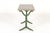 A decorative pair of 19th century cast iron bistro or café tables, retaining their original green painted surface and...