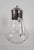 Elegant Italian pitcher produced during the 1950s, combining hand blown glass with a silver-plated mount and hinged lid....