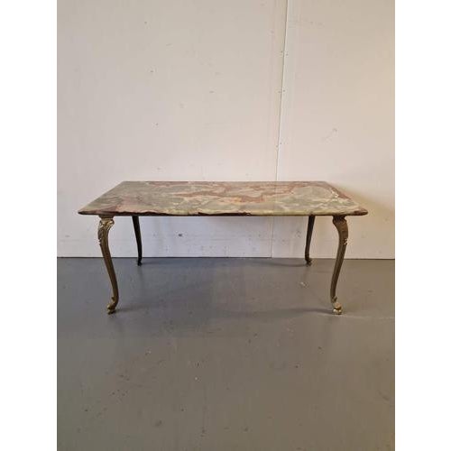 Coffee table with onyx top.France.1970s.Brass, onyx.Dimensions: height 44cm; length 100cm, width 50cm