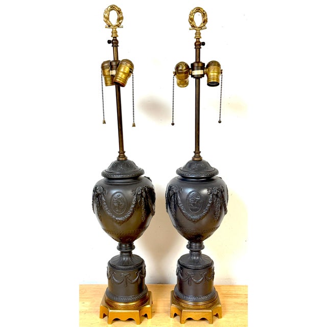 Pair of Warren Kessler Wedgwood-Style Black Basalt Neoclassical Urn Lamps A striking and architecturally scaled pair of...