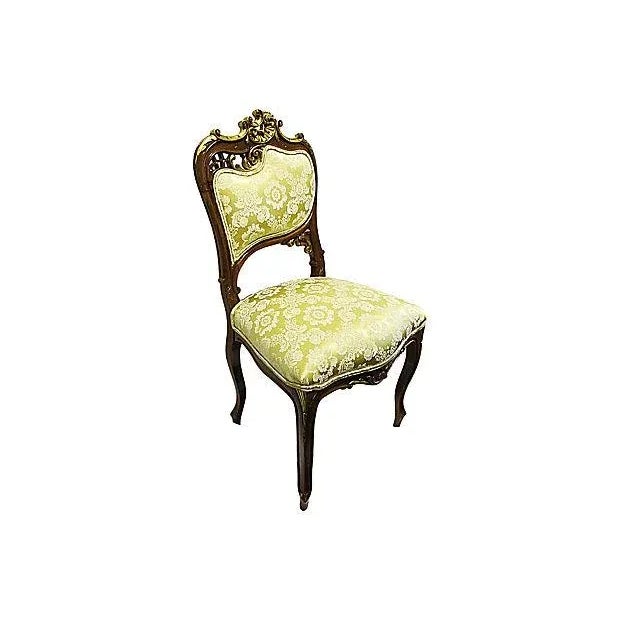 Antique 19th century French Art Nouveau-period side chairs with fresh Venetian yellow silk upholstery. Walnut frame with...