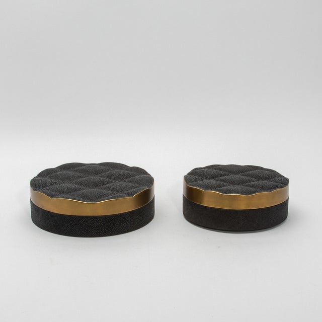 The "Coco" round box in black shagreen with bronze patina brass exudes unparalleled luxury and craftsmanship. Its...