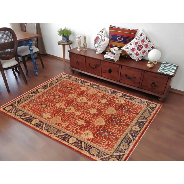 "Enhance the ambiance of your home with this magnificent Persian-influenced Turkish hand-knotted rug made by skilled...