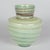 A vintage Mdina art glass vase handcrafted in Malta featuring characteristic sea foam green color with earth toned banded...