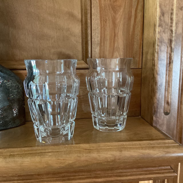 An exquisite, matched pair of vintage clear lead crystal vases by legendary French maker Baccarat. Substantial and...