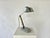 Art Deco Modernist table lamp, France, c.1920-30 Stainless steel arms with a heavy marble base. Adjusts and holds all...