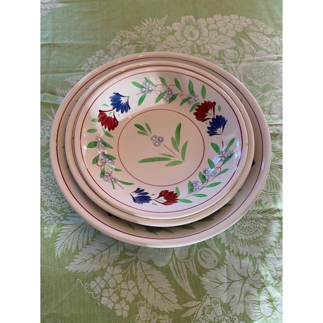Here we have a beautiful set of large old ironstone nesting bowls. These are hand painted in a French Provincial Quimper...