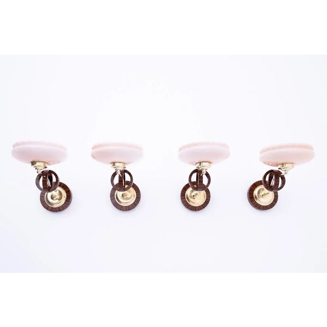 Four Art Deco wall lamps from the mid-20th century. Wall lamps with a geometric form characteristic of the Art Deco style....