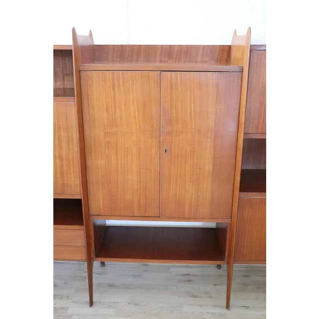 Italian design bookcase or cabinet 1960s high quality furniture. This Italian design furniture is made of teak wood and...