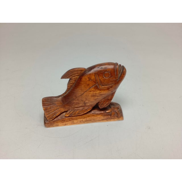 Folk Art Hand-Carved Wood Fish. This is a great little piece. He only measures 4 inches long by two and three-quarter...
