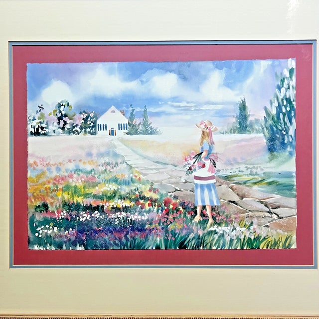 Original watercolor by American artist Carolann Dvorak, depicting a young girl standing along a stone path in a flower-...
