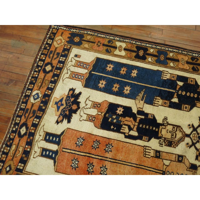 An Ivory ground Balouch pictorial gallery rug from the middle of the 20th century Details rug no. 31363 size 4' 8" x 11'...