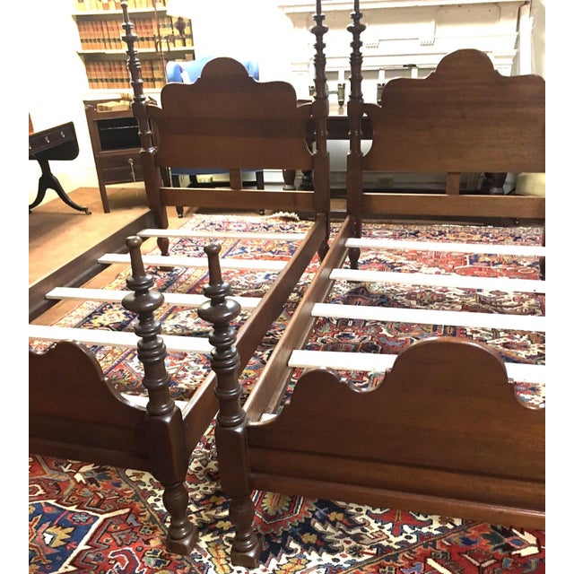This handsome pair of twin mahogany American Sheraton style beds features multiple turnings of the posts that extend all...
